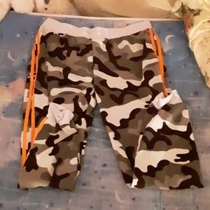 Camo with orange stripes on the sides.